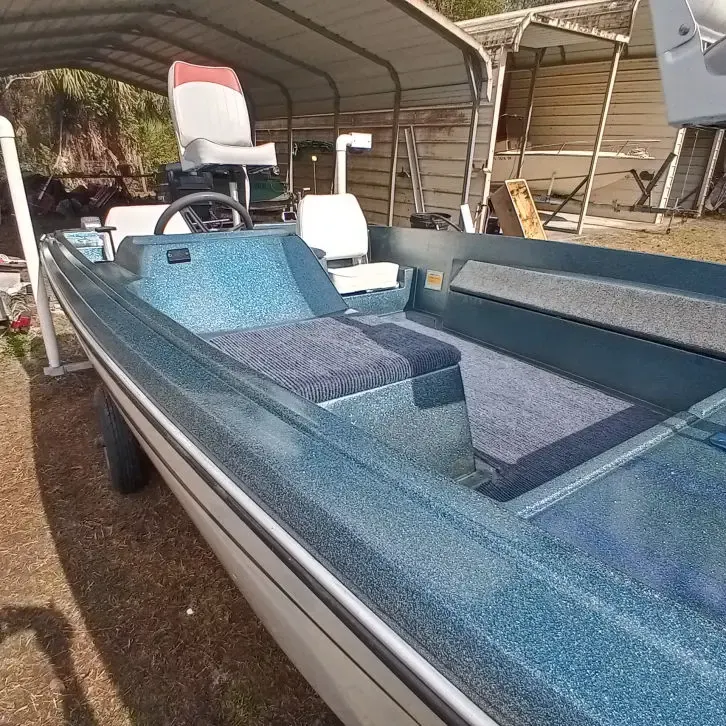 Blue boat interior with vinyl seats and carpet