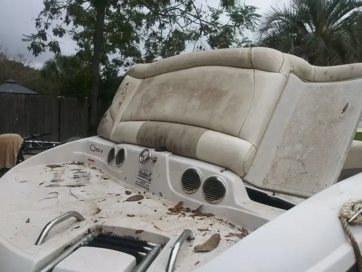 Boat seats and console covered in dirt and mildew before detailing