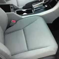 The same grey seat clean after detailing