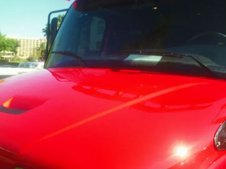 Glossy red hood after decal removal